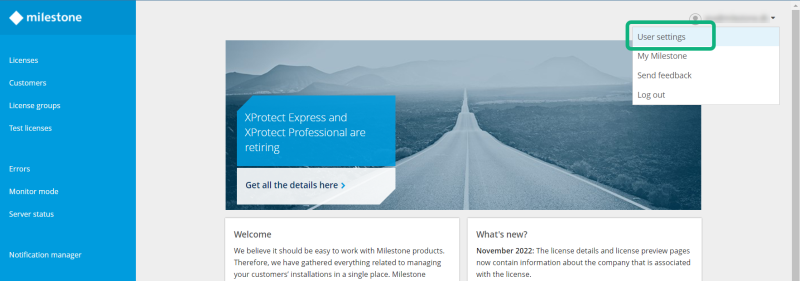 The dropdown menu under the user name in Milestone Customer Dashboard.